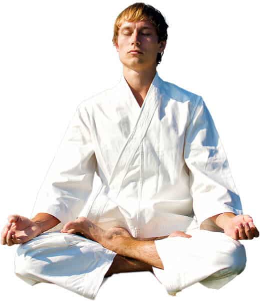 Martial Arts Lessons for Adults in Austin TX - Young Man Thinking and Meditating in White