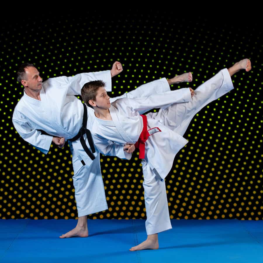 Martial Arts Lessons for Families in Austin TX - Dad and Son High Kick
